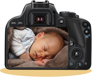 SLR camera with a photo of a baby on the display